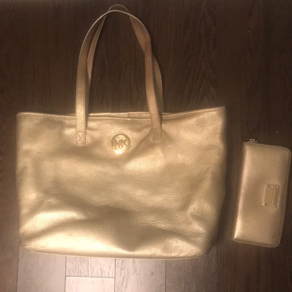 Gold Michael Kors purse and wallet